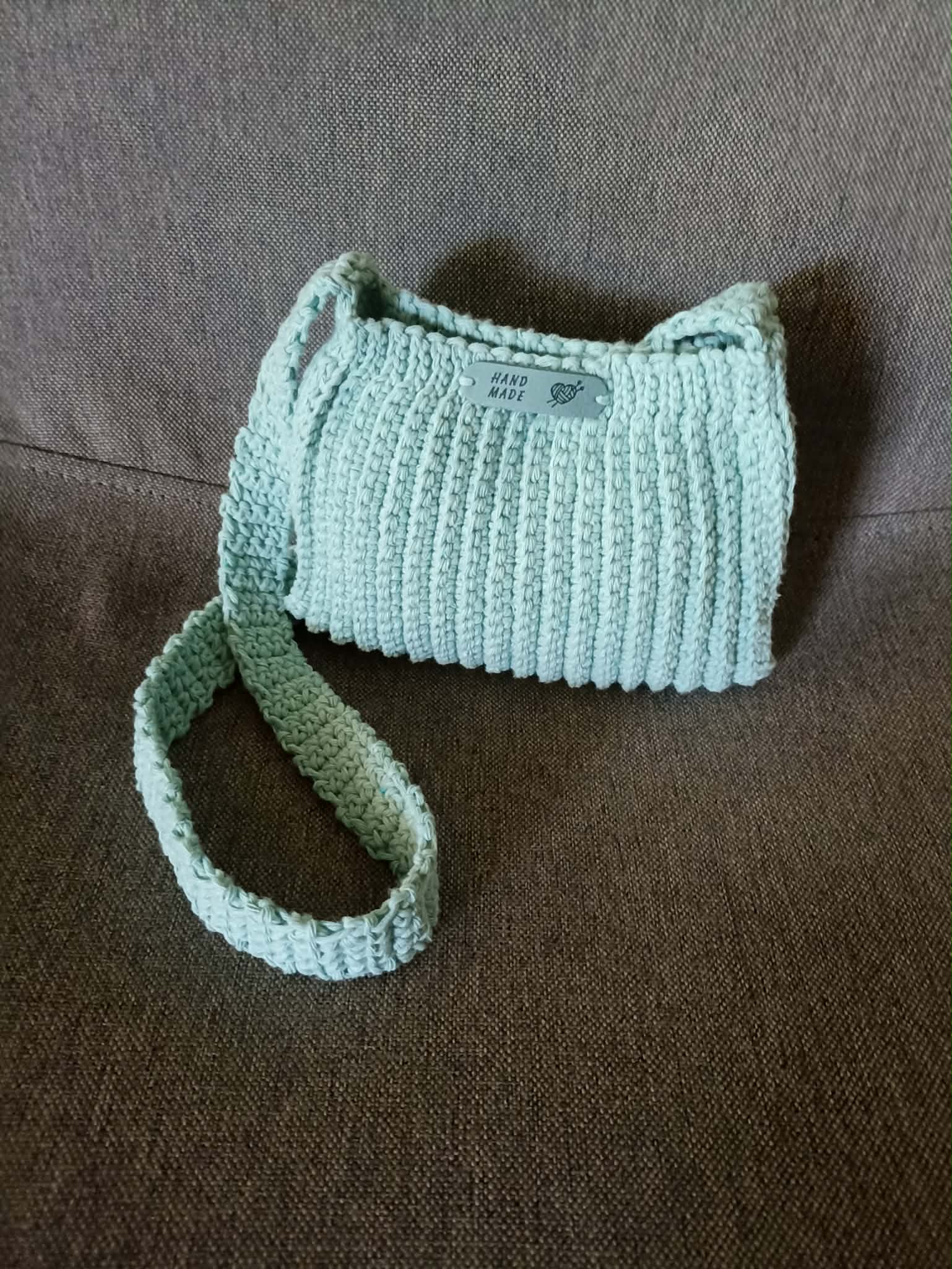 Light blue crochet coin purse with strap and metal clasp